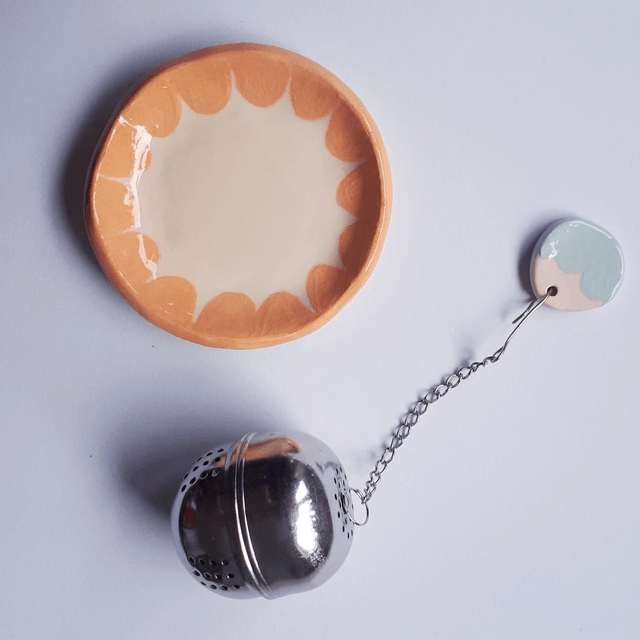 Petite coupelle et sa boule à thé 